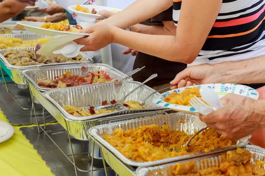 Guests serving from buffet spread